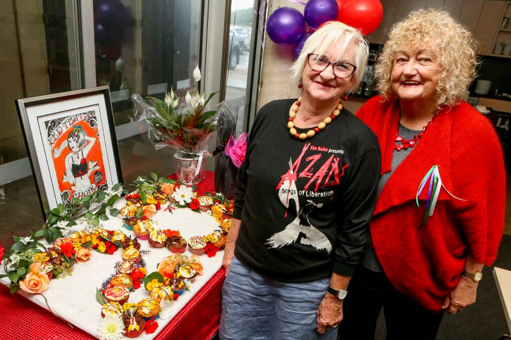 CELEBRATION: Gail Lowen and Carol McDonald, members of the Red Tent Singers, get ready to enjoy some cake. Picture: Chris Doheny