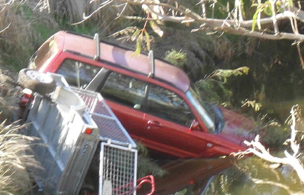 DANGER ZONE: This vehicle was submerged in water after an accident at the Chatsworth bridge. Picture: Ron Woff