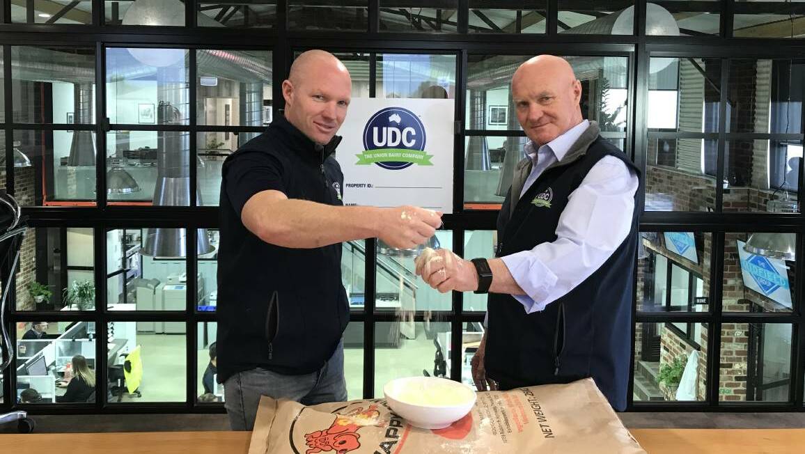 Dean and Colin McKenna make a toast with Union Dairy Company milk.