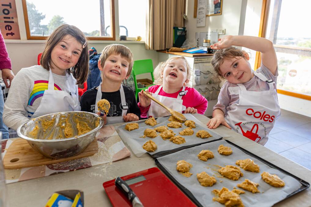Sprouts Club members Bayley Parkes, 6, Tyler Parkes, 4, Caitlyn Inns, 4 and Indiana Inns, 6, bake up a storm with produce from the garden. Picture by Eddie Guerrero.