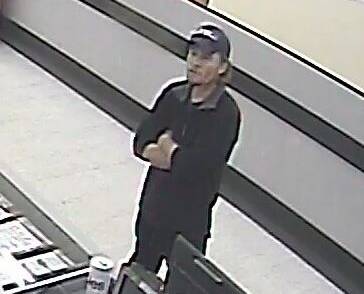 Police would like to speak to this man, who made a purchase at a supermarket on May 18.