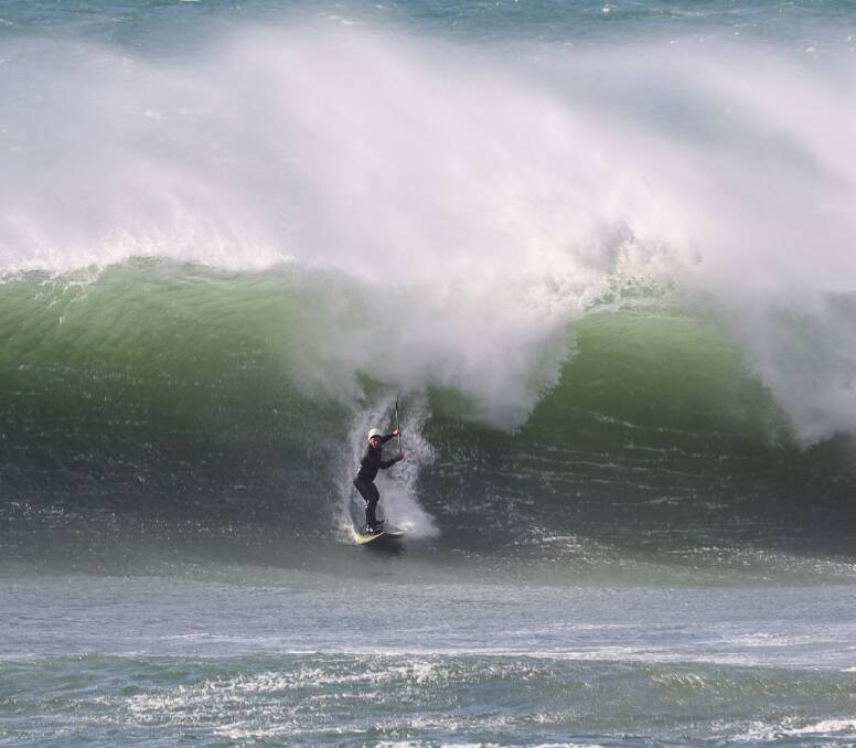 HUGE SWELLS: A surfer makes the most of the waves at Portland on Sunday. Picture: Allen McCauley
