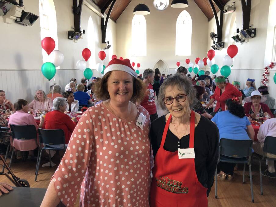 TRADITION: Volunteers Lois Johnson and Mary Lancaster at the community Christmas lunch in 2019. Picture: Kyra Gillespie