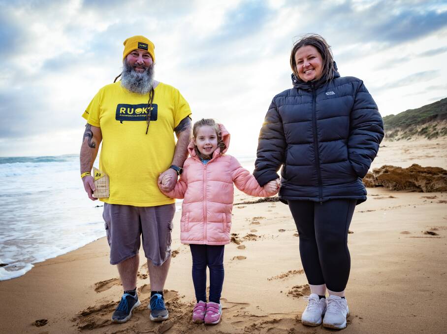Nathan McKane with his partner Erin Paul and their daughter Harper, 6, at the Hopkins River mouth. Picture by Sean McKenna