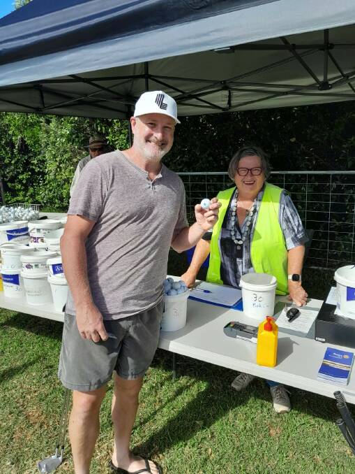 Ballarat's Mark Squire, pictured with competition volunteer Ruth Barratt, hit a hole-in-one last week. Picture supplied