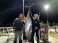 James Cauchi and Ashby Hoey with the bluefin tuna they had to fight a bull seal for. Picture supplied