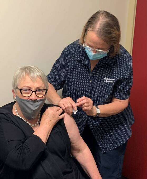 HAPPY TO OBLIGE: Member for Western Victoria Bev McArthur receives a coronavirus vaccine at the Robinson Street clinic in Camperdown.