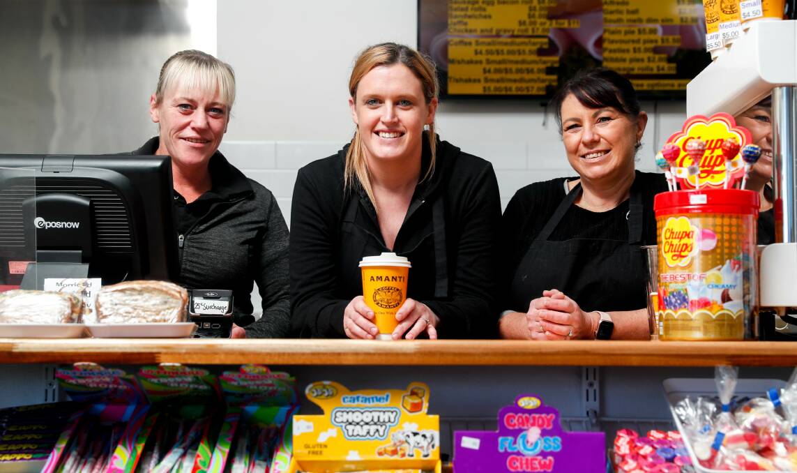 FRESH START: Morriss Road Takeaway owner Jess Chapman (centre) with staff members Amanda Chapman and Sarah Cooke. Picture: Chris Doheny