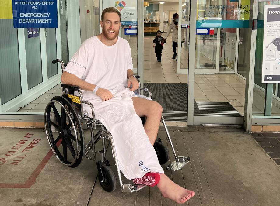 Ben Davidson gets some fresh air at The Canberra Hospital following surgery on his shattered leg. 