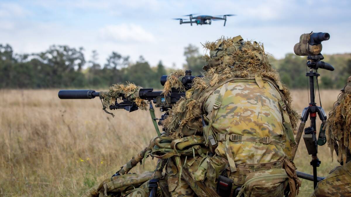 A small unmanned aerial vehicle is deployed during live fire training. Picture Defence
