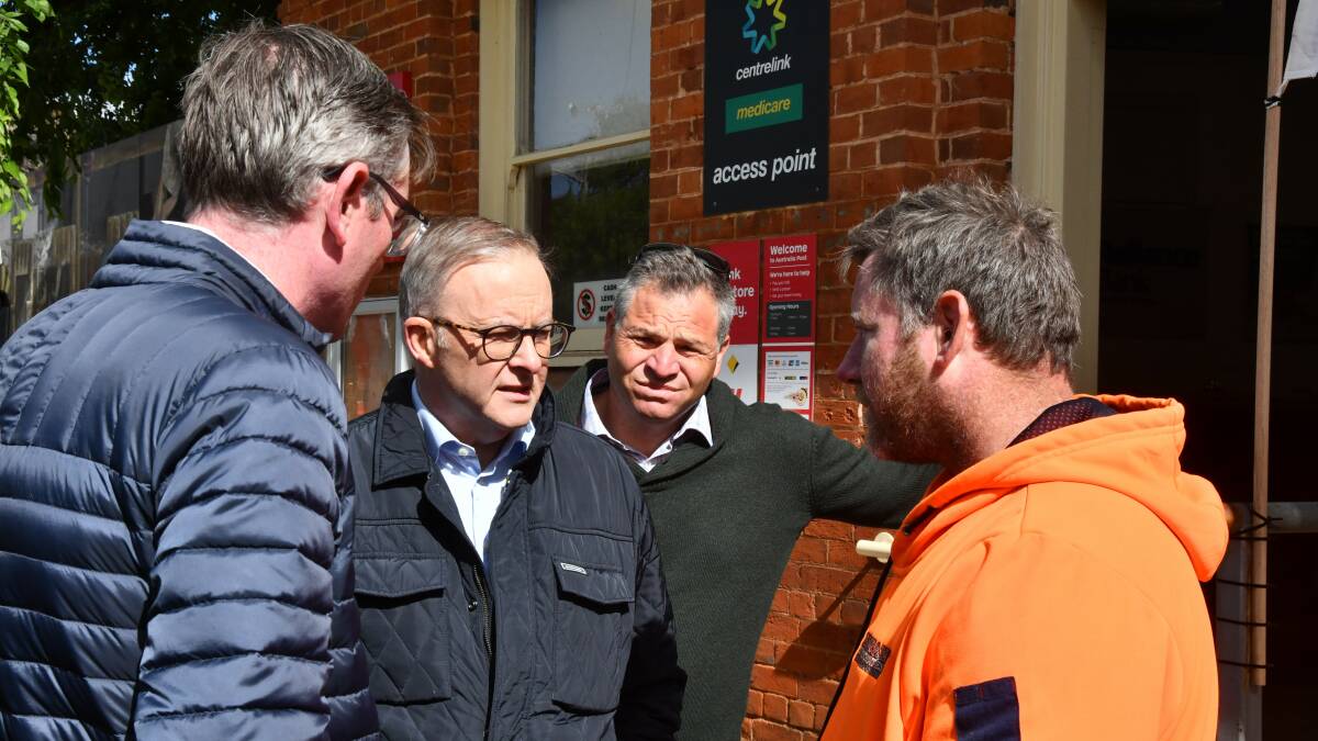 Eugowra man Anthony Robinson speaking to Dominic Perrottet, Anthony Albanese and Phil Donato on Tuesday. Picture by Carla Freedman.