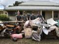 Lachie Nixon, Dylon Ryan, Johnny Vella, Brad Hoadley during the initial clean-up in Eugowra on Wednesday. Picture by Carla Freedman