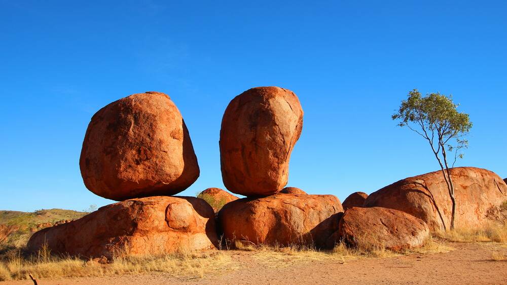 The rocks seem to defy gravity, holding a perfect posture. 