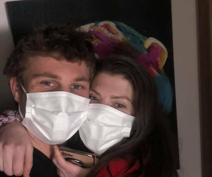 All clear: Portland's Kane Kennett and his girlfriend. He is out of isolation after health authorities cleared him of coronavirus. 