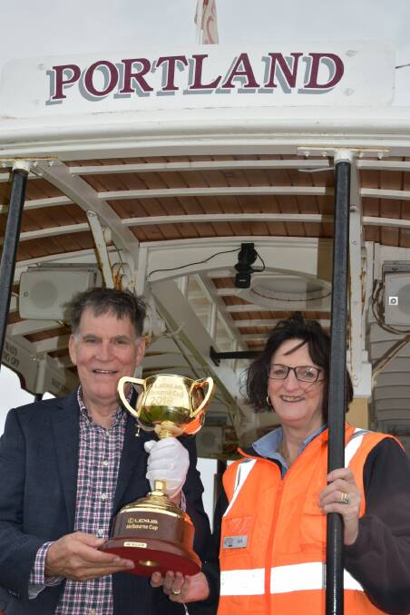 Cup contenders: Former Victorian chief steward Des Gleeson and Portland's Joy Hocking with the Cup on the Portland Cable Tram.