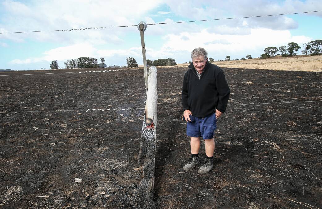Time for action: The Sisters dairy farmer Jack Kenna with the pole that snapped on his property and caused a bushfire almost two years ago. Powercor is planning to not quite double its current pole replacements over the next five years when a secret report called for an up to eight-fold increase.