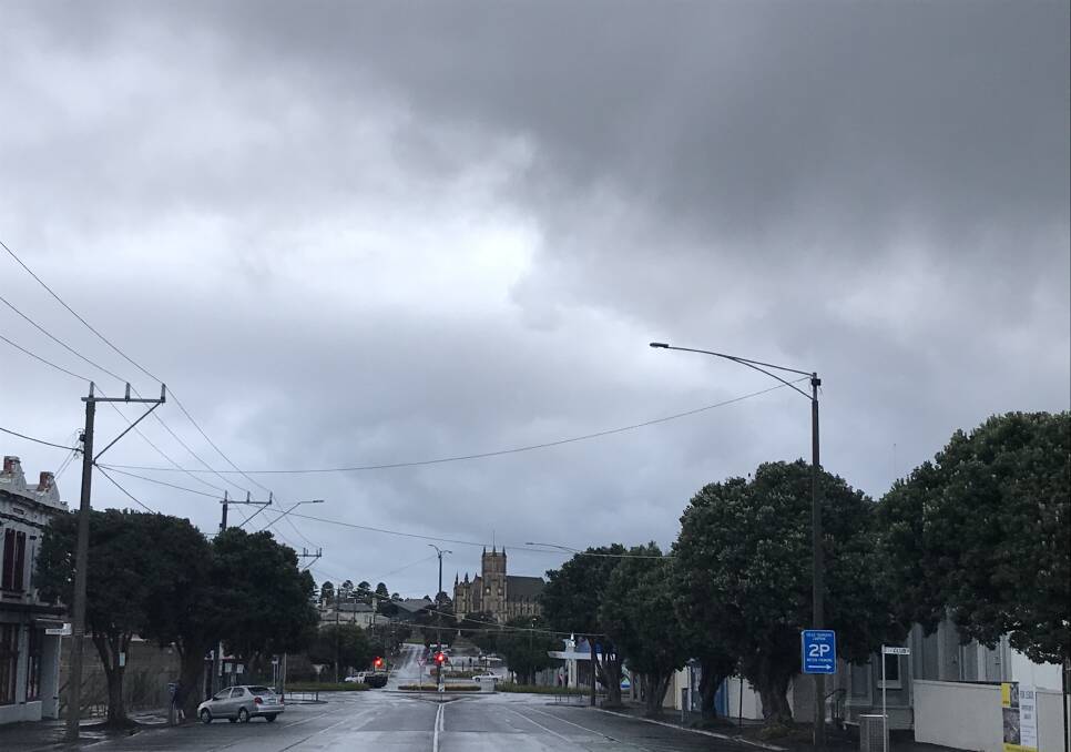 Grim: It was pretty dark and miserable at 7am looking north in Warrnambool's Kepler Street. But, Saturday and enxt week are looking much better.
