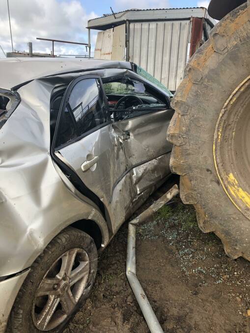 The Mazda collided with the parked tractor in the single-vehicle collision at a notorious intersection on Saturday morning.