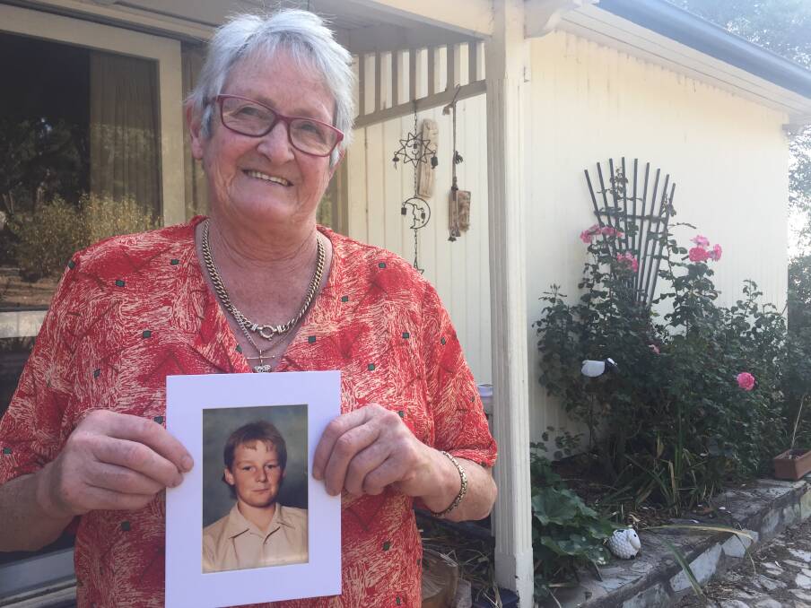 Gone: Helen Watson with one of her favourite pictures of her son Peter. He was abused by former priest Paul David Ryan and took his own life. Helen is now calling for victims to seek help.