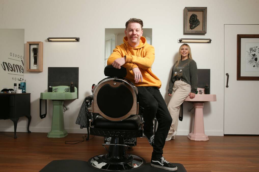Cutting edge: Jimmy Bedson in his new shop, the Crooked Gentlemen Barbershop with Madison Hirst. (This picture was taken on Thursday before the lockdown). Picture: Chris Doheny