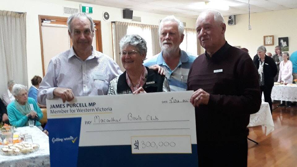 Cashing in: Western Victorian MP James Purcell with Macarthur bowlers (from left) Mary Millard, John Bragg and Don Jasper.