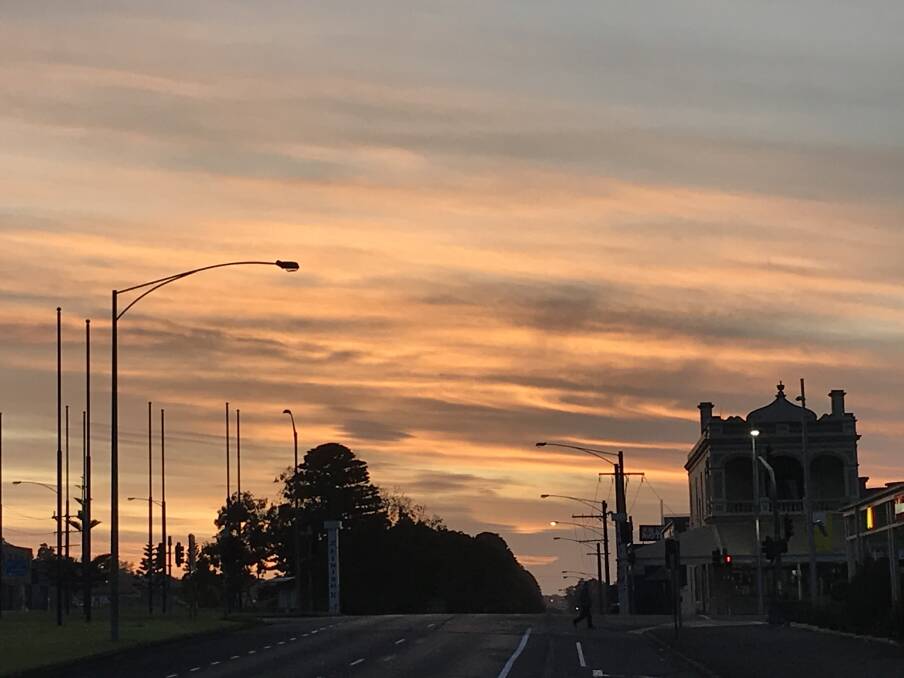 Bright start: Looking east down Raglan Parade in Warrnambool at 6.30am past the Liebig Street intersection. Warrnambool is expecting a top of 20 degrees.