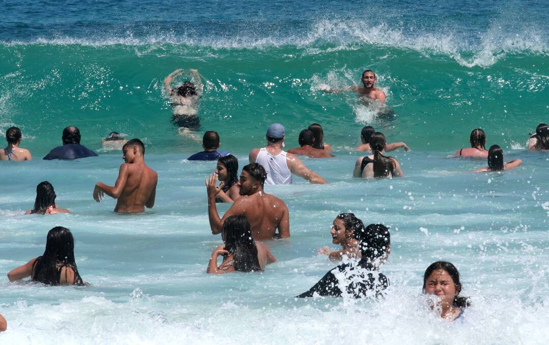 Scorcher: People cool off at Sydney's Bondi Beach on Tuesday.