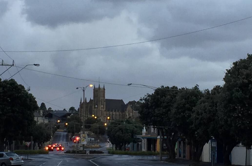 Bleak: Today will be another mild and cloudy day across the south-west. It was gloomy looking up Warrnambool's Kepler Street at 7am.