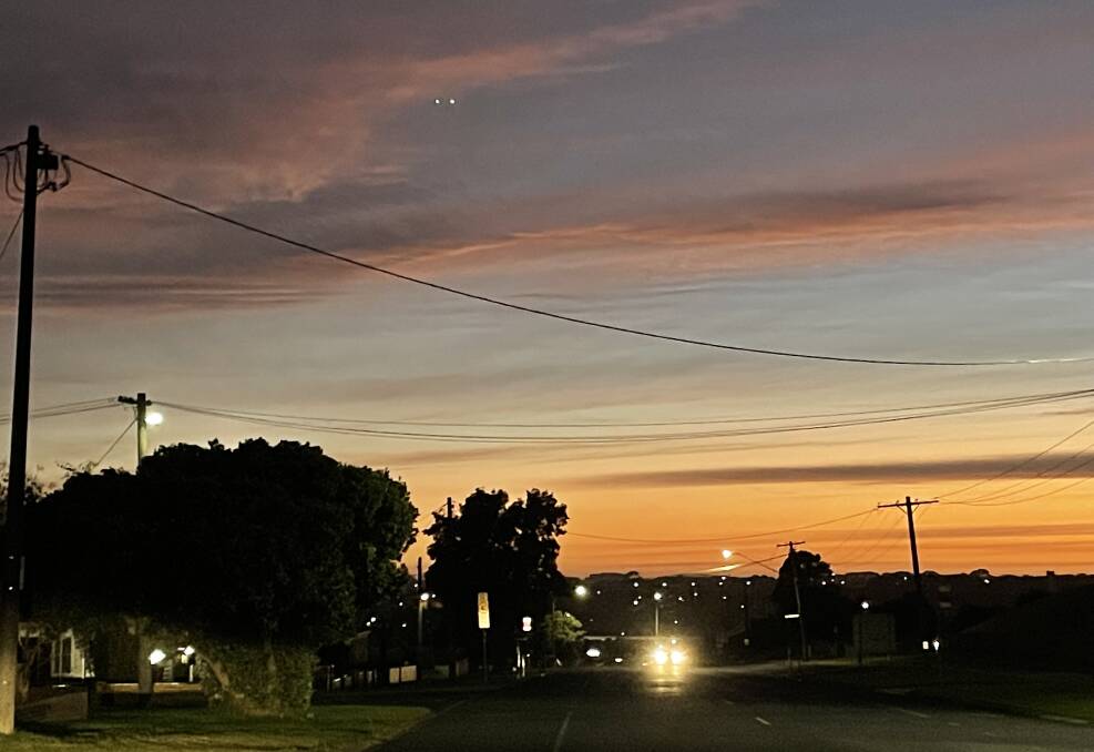 Colourful start: Looking north up Cramer Street in Warrnambool at 6.45am this morning. Warrnambool is expected to receive up to 20mm of rain this afternoon and evening.