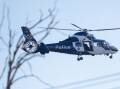 A police helicopter is currently conducting a search in the Warrnambool foreshore area.