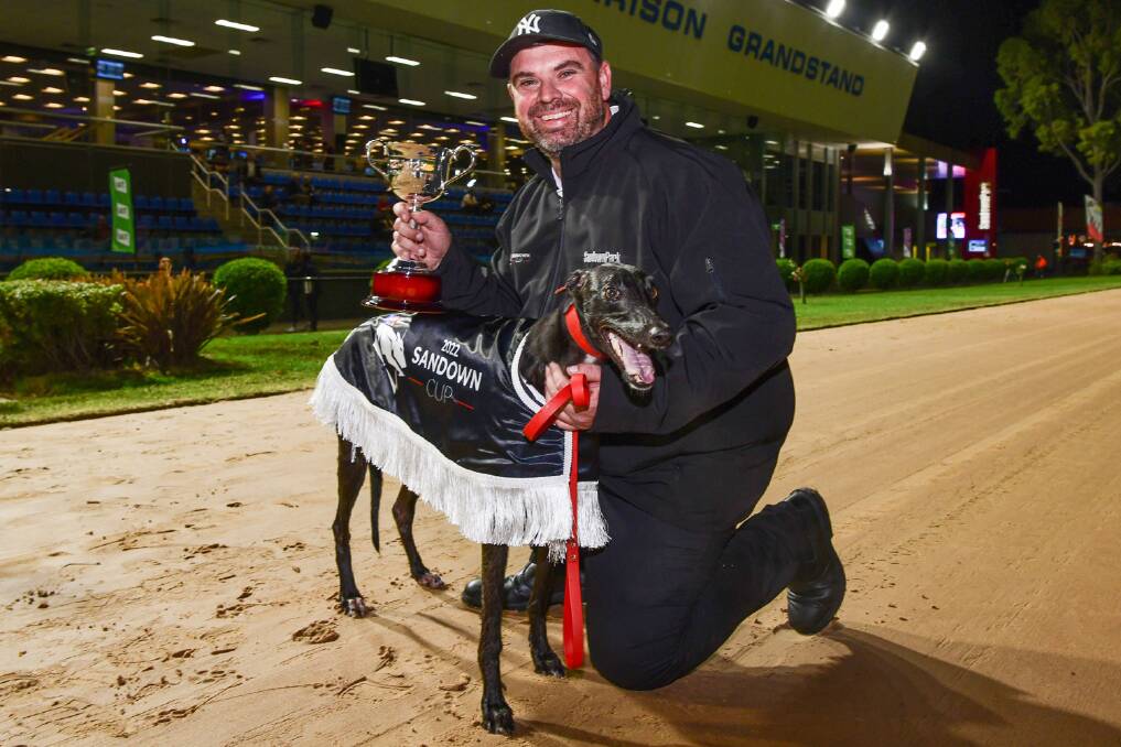 Break-through: Dennington trainer Dustin Drew with Untapped after their Sandown Cup success on Thursday night. Picture: Greyhound Racing Victoria
