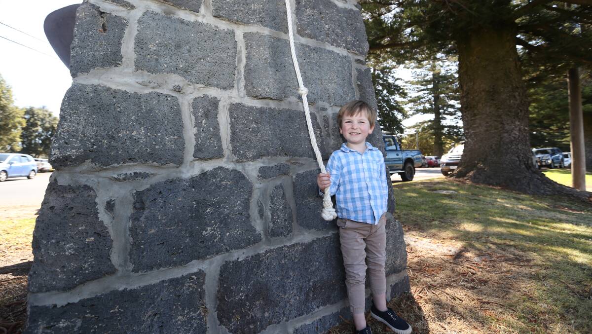 Big job: Ringing the bell to signal the end of the ceremony was Angus Haldane, 5, at the official opening of the Port Fairy wharf development. 