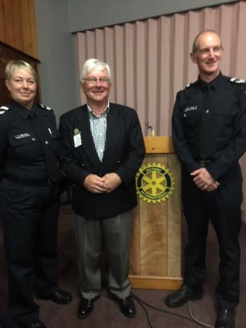Acknowledged: Dr John Birrell award winners senior constables Trudy Morland (left) and John Keats (right) with East Warrnambool Rotary's Bill Hewitt. 