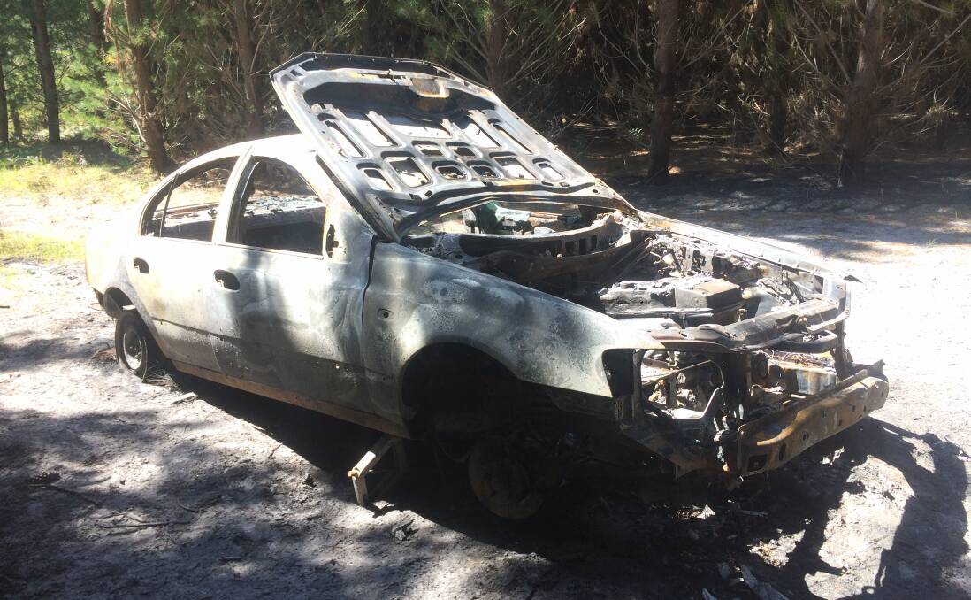 Torched: The silver Ford sedan was found burnt out in a pine plantation mid last week.