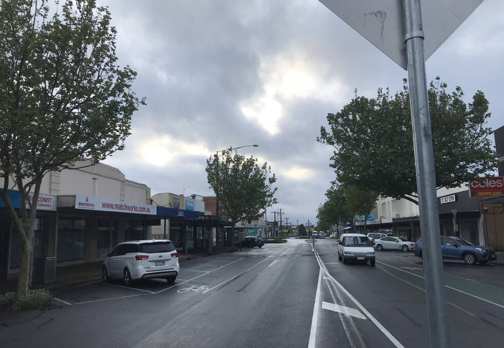 Cloudy: The sun was trying to peek through at 7am looking east down Warrnambool's Lava Street.
