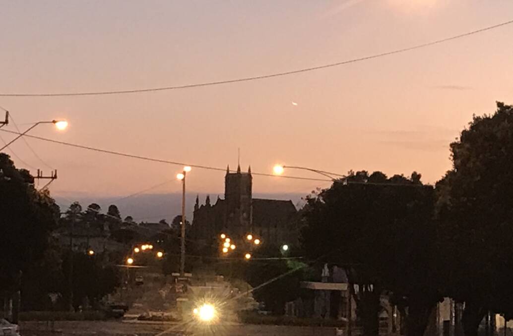 Pretty: There was a pink glow in the northern sky looking up Warrnambool's Kepler Street at 7.20am. Warrnambool is expecting a top of 21 degrees.