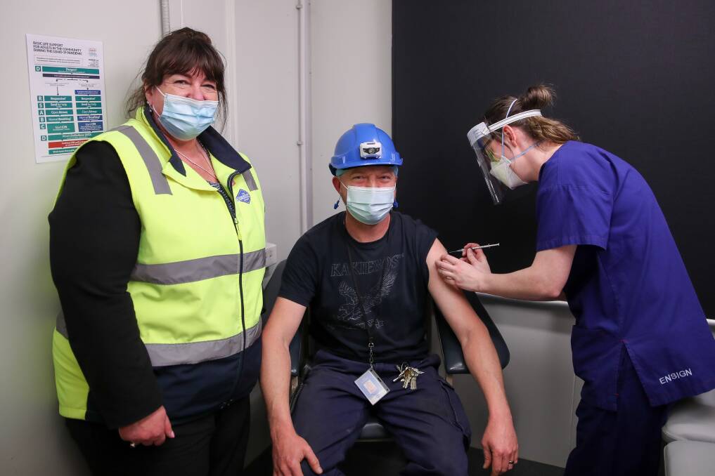 Jabbed: Midfield HR manager Shelley Smith (from left), maintenance worker Daniel Van Wyngaard and an Aspen Medical Australia nurse. About 400 employees received an injection this week.Picture: Morgan Hancock