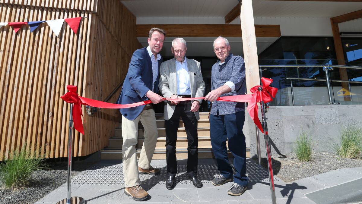Cutting edge: Federal minister Dan Tehan helps cut the ribbon with long-time wharf board members Gary Stewart and Bill Dalton ​at the opening of the Port Fairy wharf redevelopment. Pictures: Michael Chambers