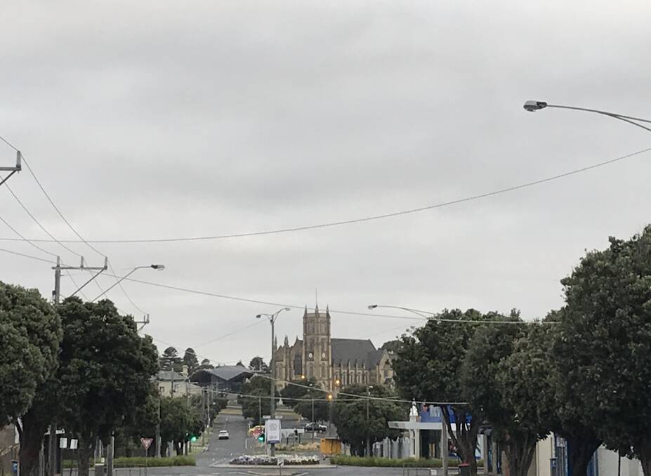Grey start to a fine day: Looking north up Warrnambool's Kepler Street just before 7am. Warrnambool is expecting a top of 27.