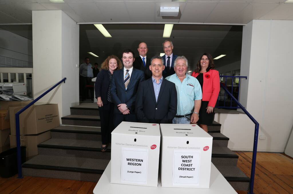 Top spot: Michael Neoh (front) with other candidates (from left) Kylie Gaston, Tom Campbell, Michael McCluskey, James Purcell, Jim Doukas and Roma Britnell at the draw.