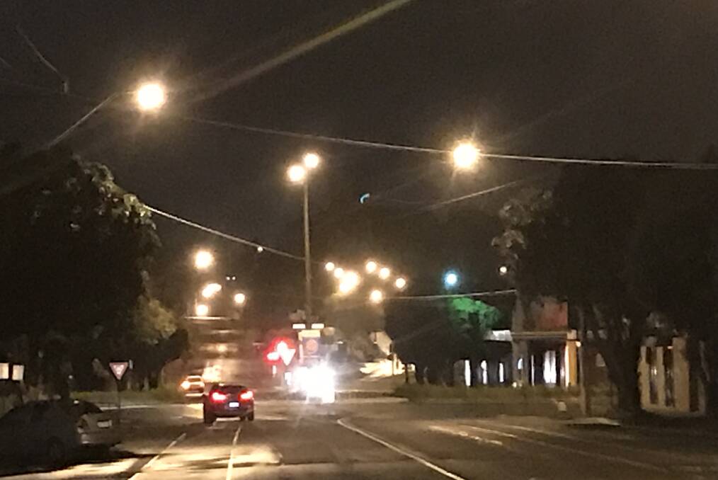 Bit bleak: It's that dark at 6.55am that you can't even see the church looking north up Warrnambool's Kepler Street. Warrnambool is expecting a top of 23 degrees.