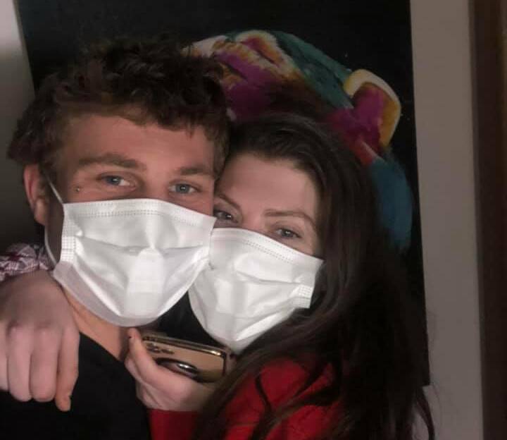 All clear: Portland's Kane Kennett and his girlfriend celebrate getting out of isolation on Monday night.