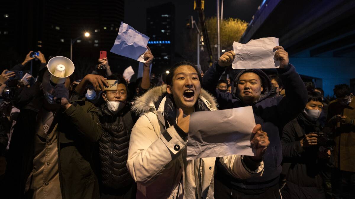 A protester shouts slogans against China's strict zero-COVID measures in Beijing on November 28. Picture Getty Images