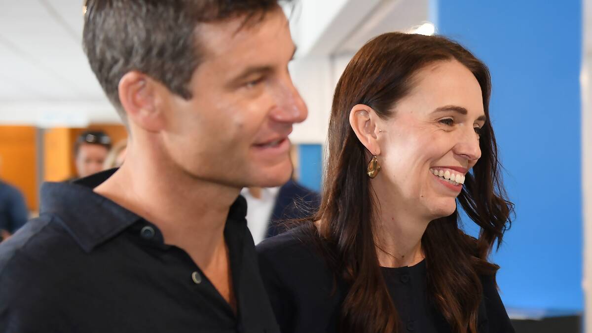 New Zealand Prime Minister Jacinda Ardern, right, with her fiancee Clark Gayford after announcing her resignation on Thursday. Picture Getty Images