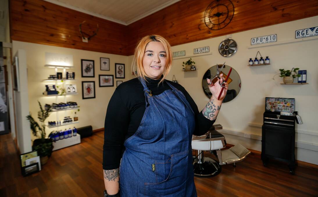 PERFECT FIT: Black Crow Barbers' Kayla Grant will lower your ears and leave chins and cheeks as clean as a whistle.
