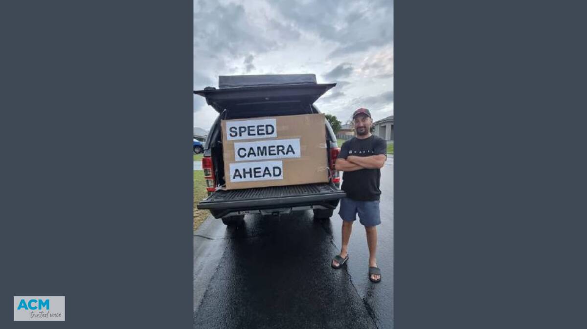 Carl Dimarzo pictured with the sign that's helping save motorists hundreds of dollars in fines. PICTURE: Supplied.