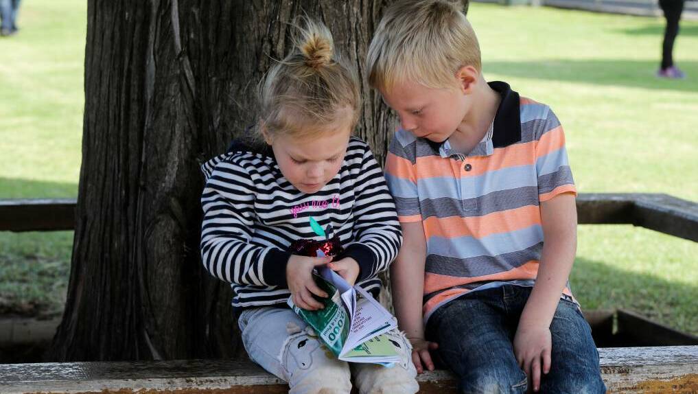Two-year-old Ruby, 2, and Braxton Boyd, 5, from Point Cook, check out the day 1 fields at Warrnambool's May Racing Carnival.