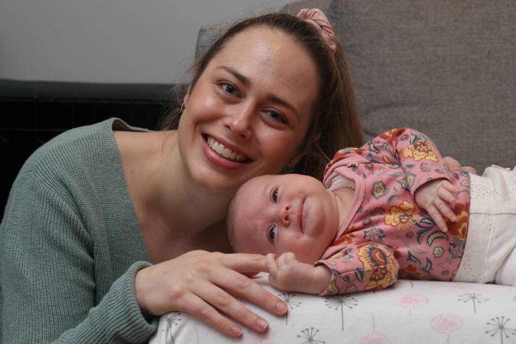 Horror pregnancy: Corrimal mother Tara Burrows with her six-week-old daughter Florence, who was born perfectly healthy after Tara suffered from Hyperemesis Gravidarum in her pregnancy. Picture: Robert Peet.
