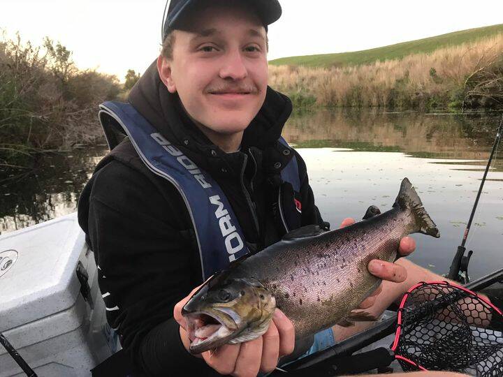 NICE CATCH: Darcy Cutter, who has put in the time in his kayak with some great results, with a nice brown trout caught from the Merri River.