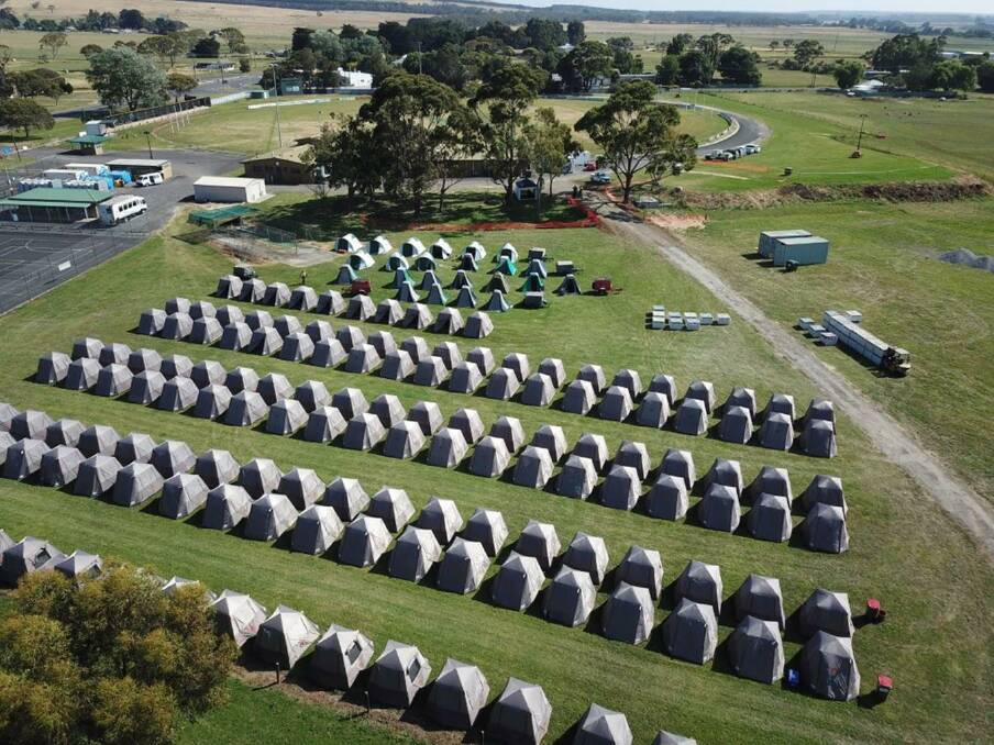 A picture taken from a drone of the tents at the recreational reserve.